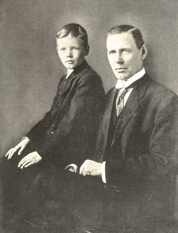 Black and white portrait of a man and a young boy