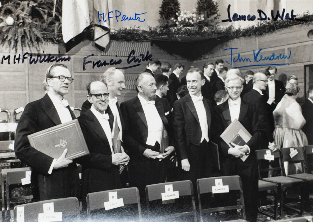 1962 Nobel Prize-Winning Scientists Signed Photograph. [James D. Watson, Francis Crick and Maurice Wilkins Signed Photograph].