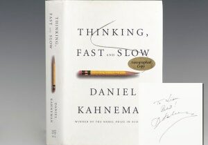 Cover and signature of the first edition of Thinking, Fast and Slow